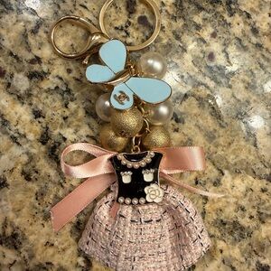 CHANEL authentic Blue Butterfly charm attached to Keychain with Pink Bow